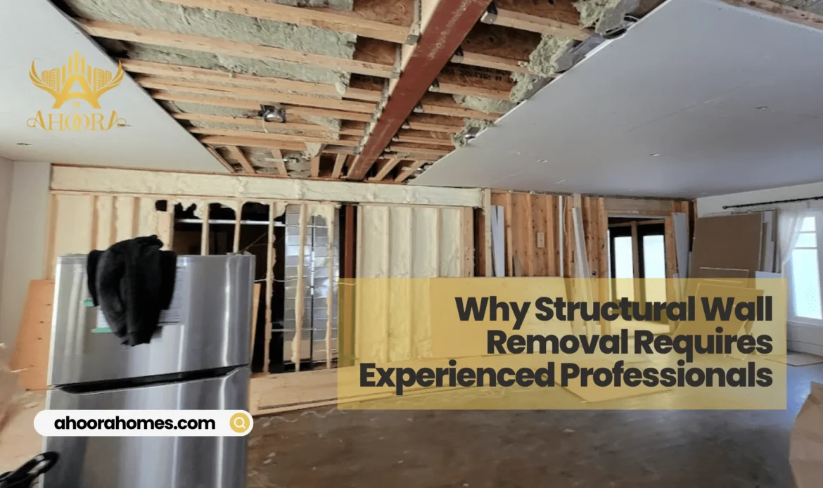 contractor installing support beam during load bearing wall removal in a Toronto home

