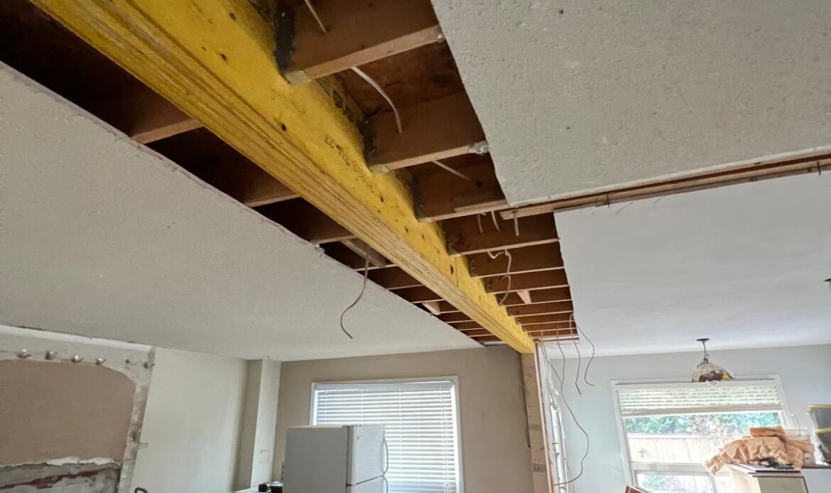 Structural wall removal and beam installation during a Thornhill home renovation